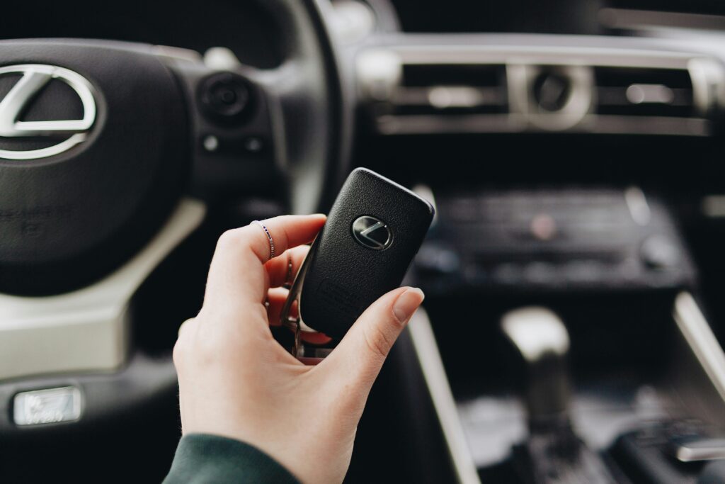 modern car key fob next to a car's ignition